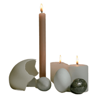 a candle, eggs, and a stone on a black background