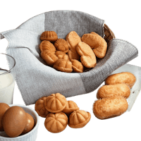 a basket of pastries, eggs and milk on a table